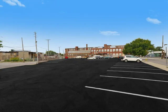 A parking lot with a lot of cars parked in it