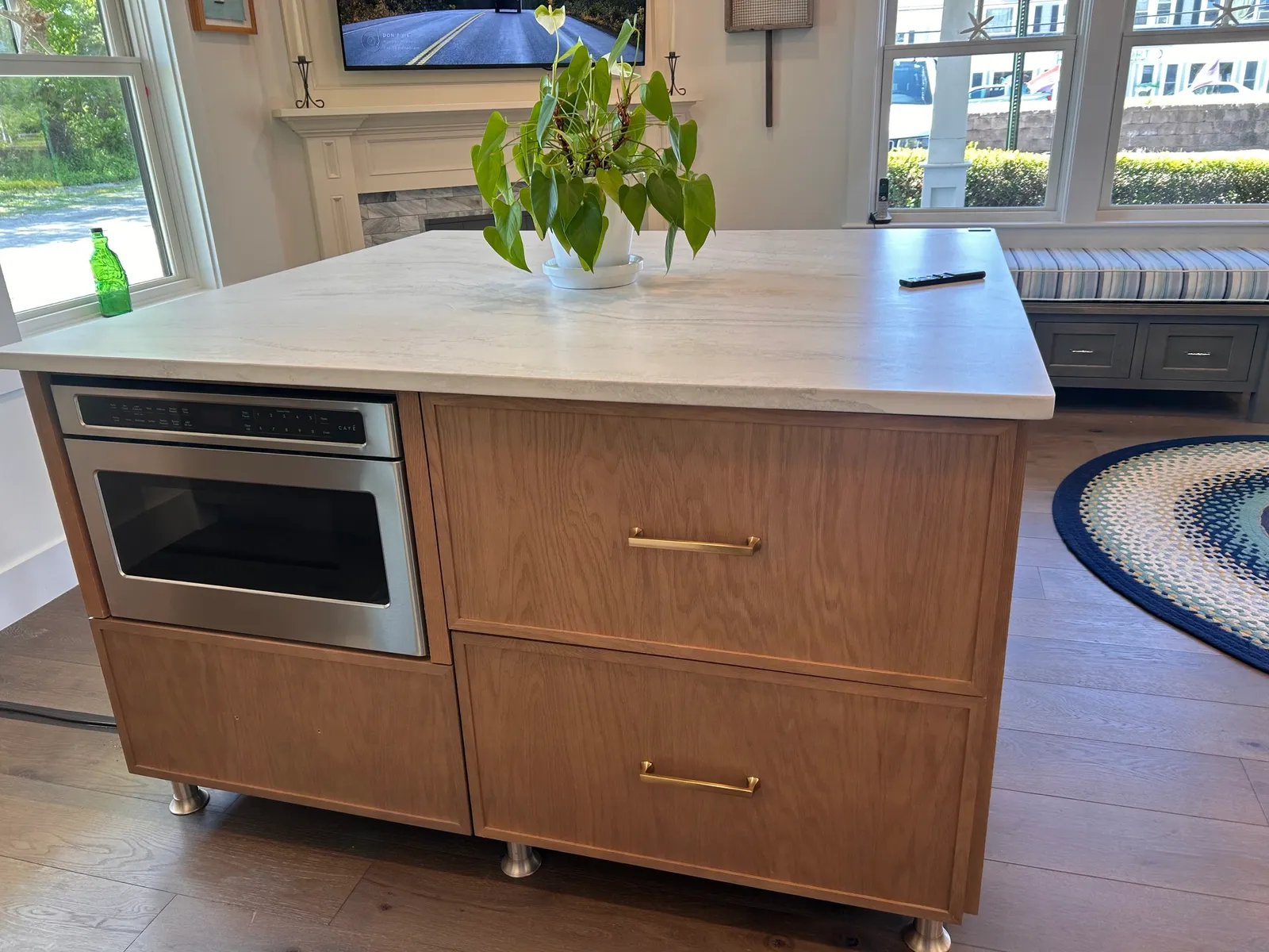 Oak island with built-in stainless oven