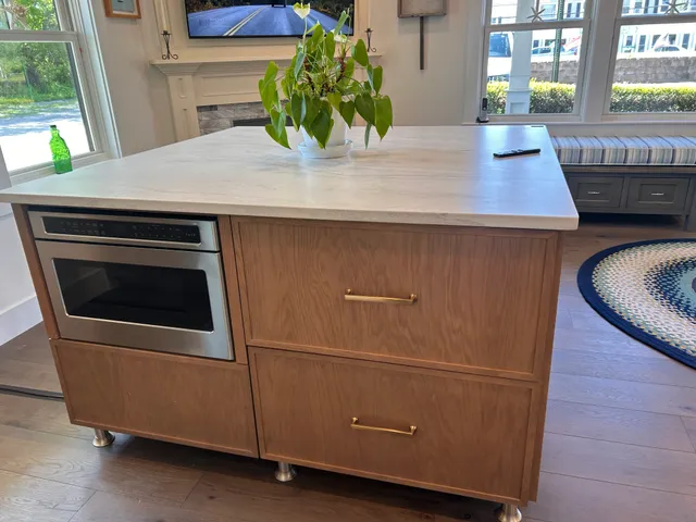 Oak island with built-in stainless oven