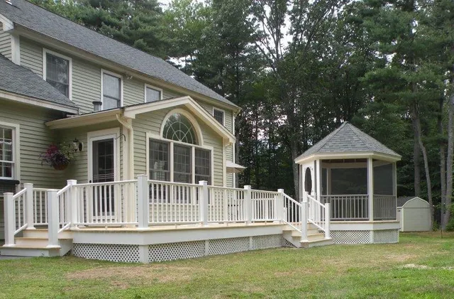Exterior shot of home with new deck and screened porch gazebo