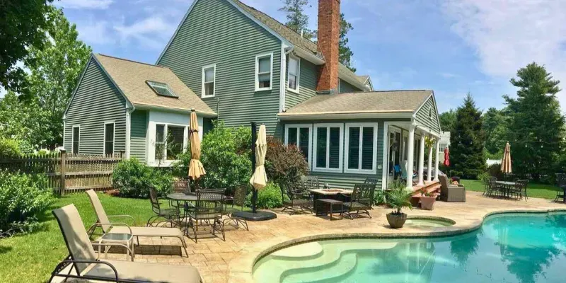 Contemporary House With Pool - Sage Green Siding - Featured Image