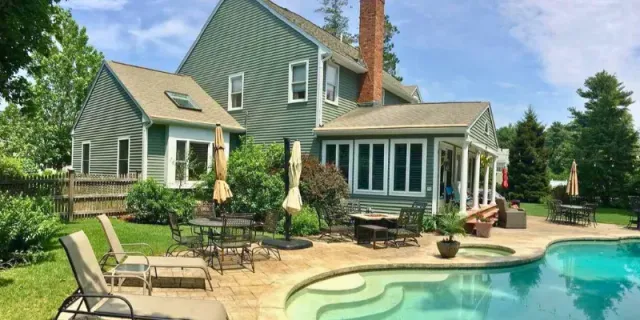 Contemporary House With Pool - Sage Green Siding - Featured Image