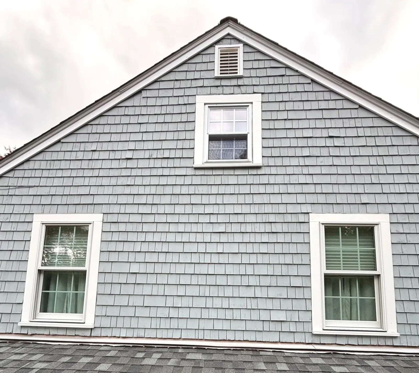 Solid stain on cedar shingles on exterior paint and restoration project in Marshfield, MA