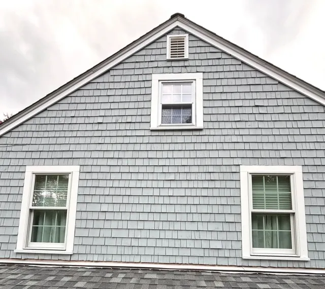 Solid stain on cedar shingles on exterior paint and restoration project in Marshfield, MA