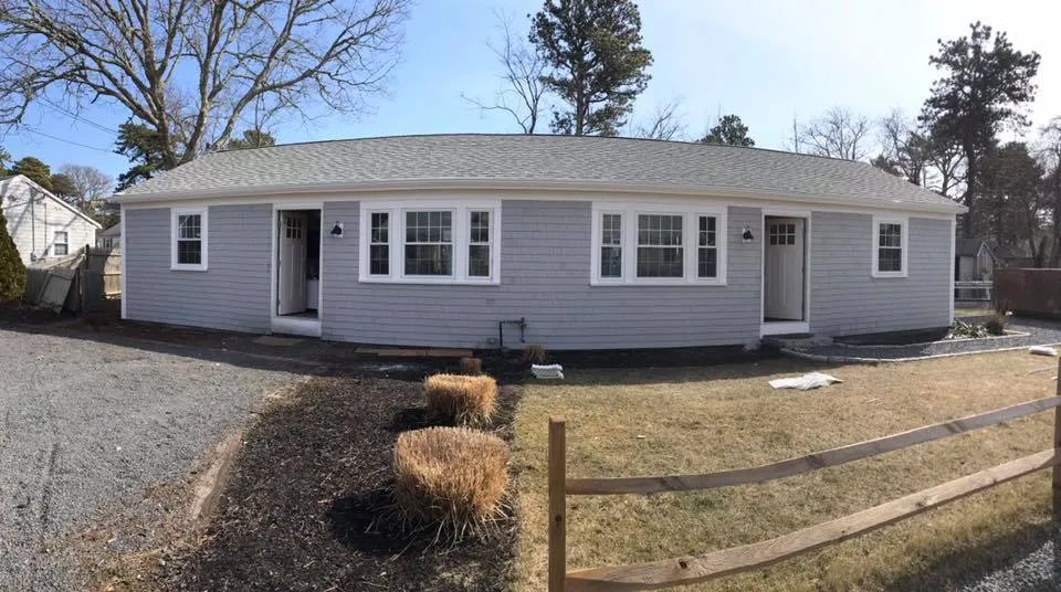 Completed roof and shingle siding on a ranch home