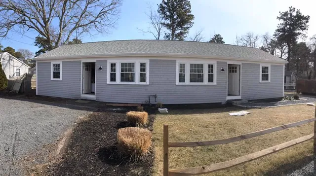 Completed roof and shingle siding on a ranch home