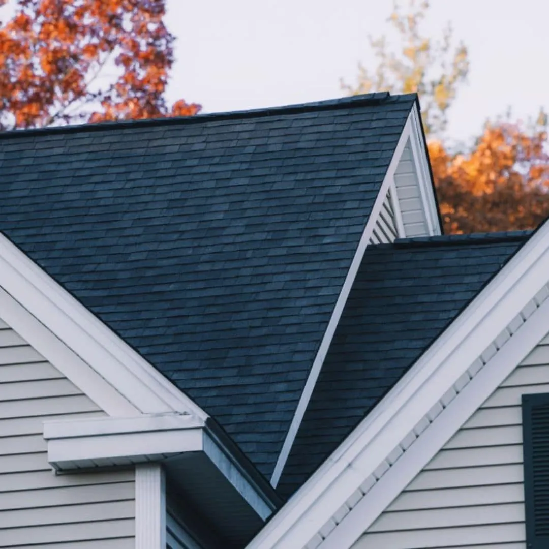 close-up view of a house roof with dark asphalt shingles