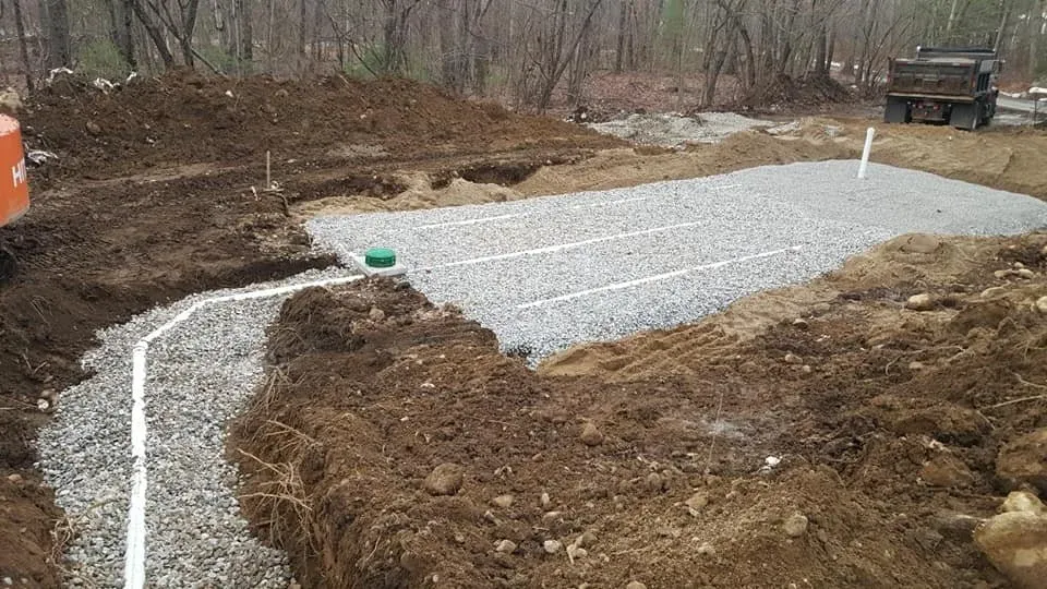 Stone and pipe leach field new septic system