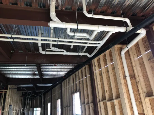 Completed commercial plumbing installation with code-compliant fixtures