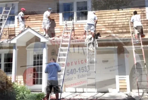 Guys painting a exterior of a house. Jonathan Painting.