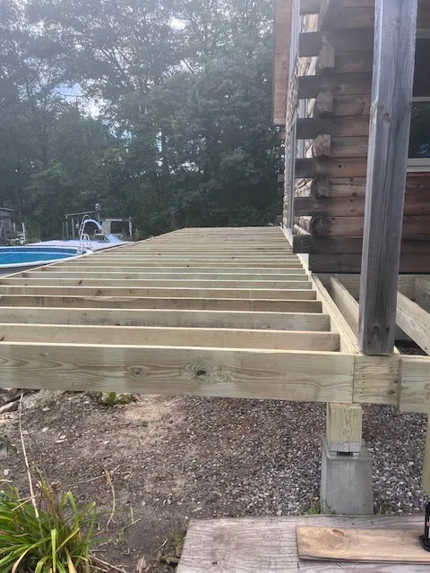 Deck joist layout during a Goffstown deck rebuild