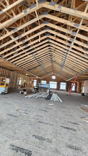Structural subfloor and roof trusses on a large open-span build