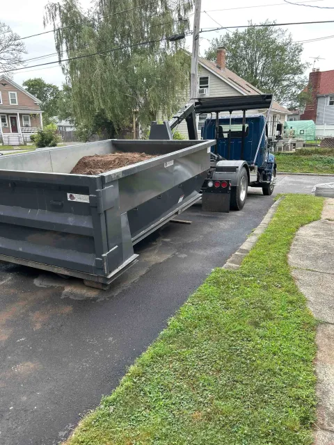 Dedicated dirt dumpster loaded with soil and clean fill