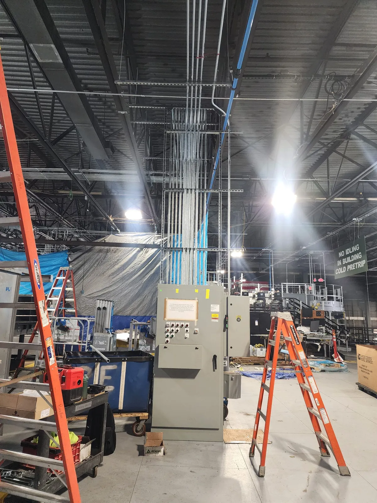 Electrical panel and conduit installation in a commercial building.