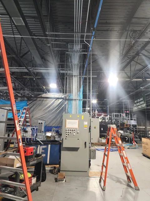 Electrical panel and conduit installation in a commercial building.