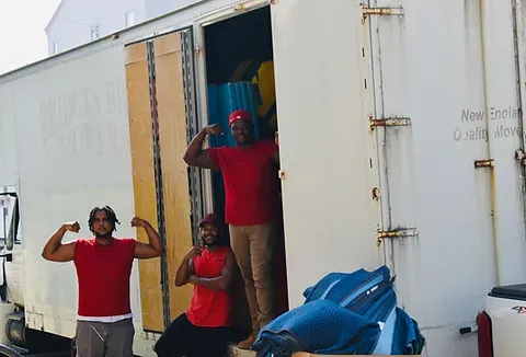 Professional moving equipment and organized storage area.