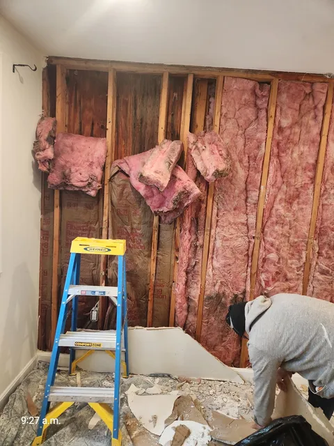 West Roxbury water damage discovery — wall demolition phase