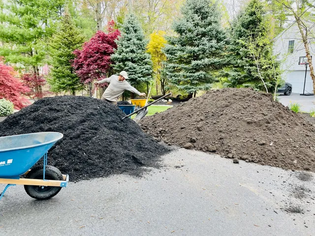 Landscaping construction with mulch and soil preparation