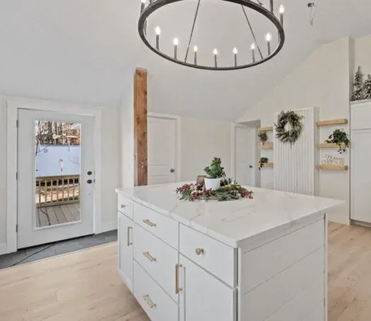 Marble kitchen island with chandelier — countertop project for a New Hampshire designer by Precision Granite Works