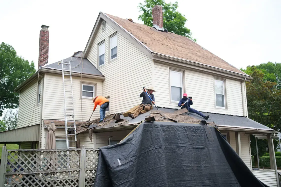Emergency roof repair and tarping after a storm in Quincy MA