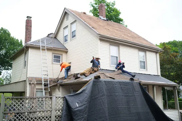 Emergency roof repair and tarping after a storm in Quincy MA