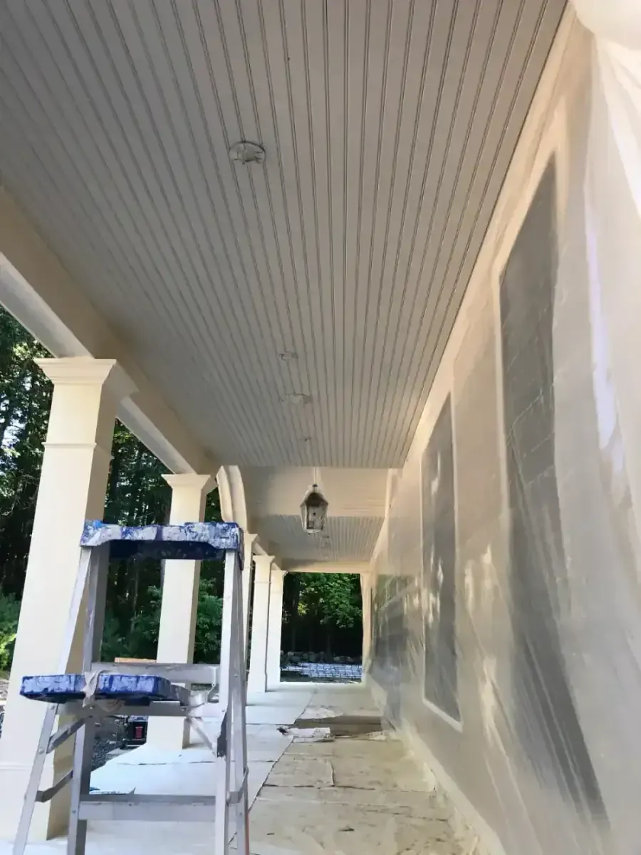 Same ceiling before — water-stained and yellowed