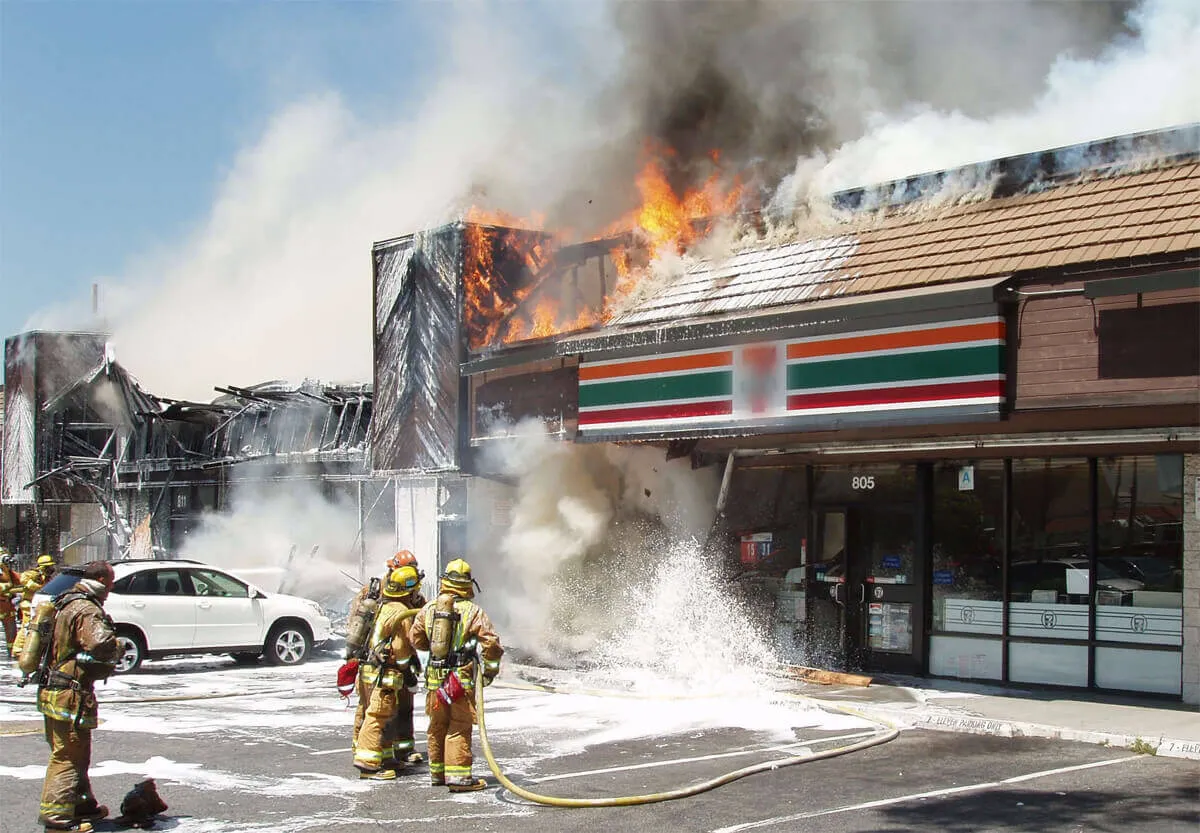 firefighters putting fire out at 7 eleven