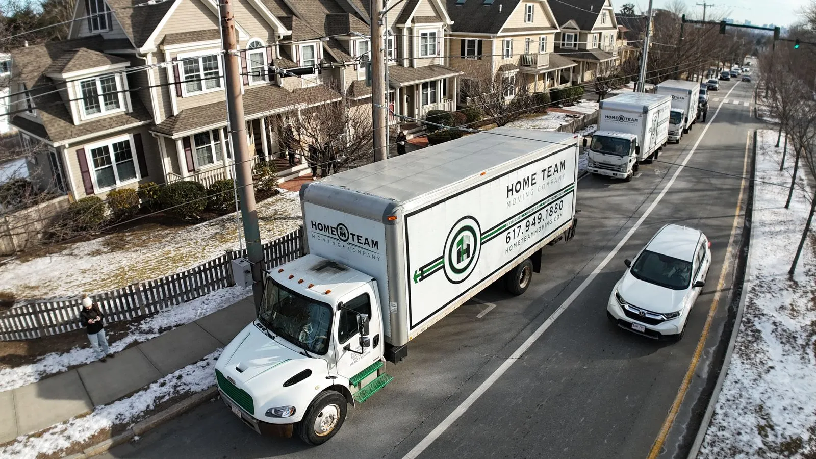 Multi-truck crew on a residential street move