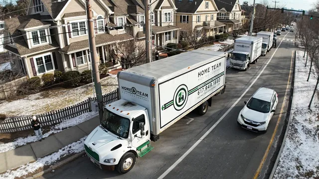 Multi-truck crew on a residential street move