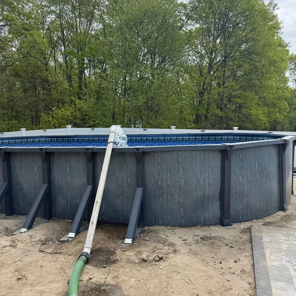 Enhance your outdoor space with our high-quality above ground pools that seamlessly integrate into your landscape design for an inviting oasis perfect for relaxation and entertainment in your backyard. for S&G Hardscaping and Plowing in Boston, MA