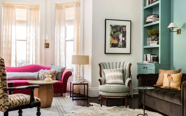 A living room filled with furniture and a large window