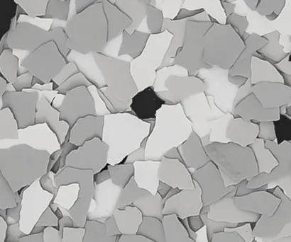 Up close picture of sample of vinyl chips for epoxy flooring.