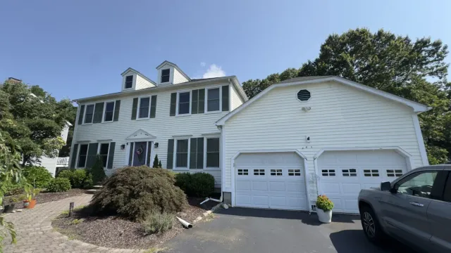 white-two-story-house-garage-siding.webp
