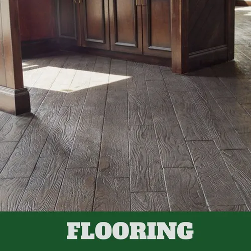 Kitchen concrete floor with brown cabinets and gray and brown concrete wood grain finish.