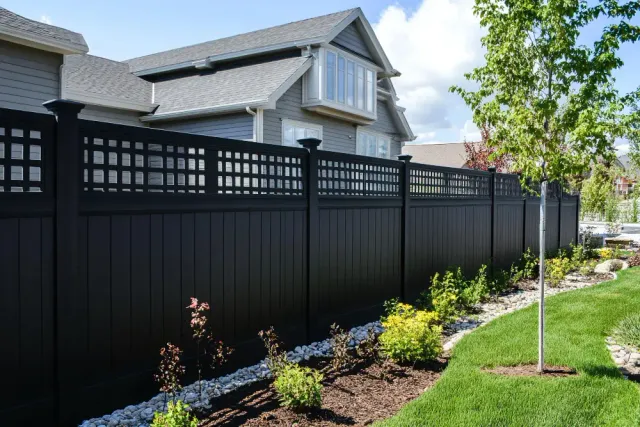 Black vinyl privacy fencing installed by Olympic Fence Co. in a North Shore Massachusetts backyard.