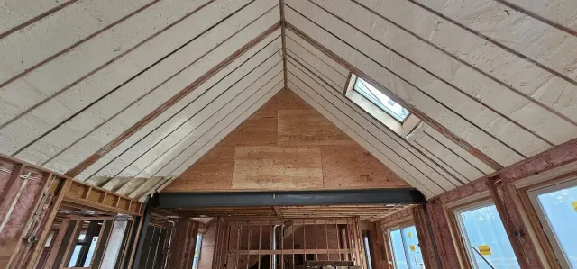 Looking up at the ceiling of a house under construction.