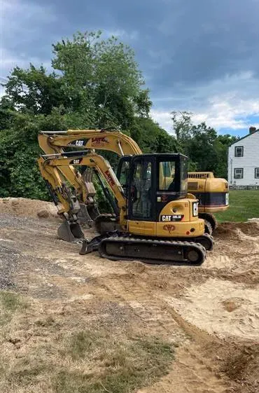Excavators on dirt