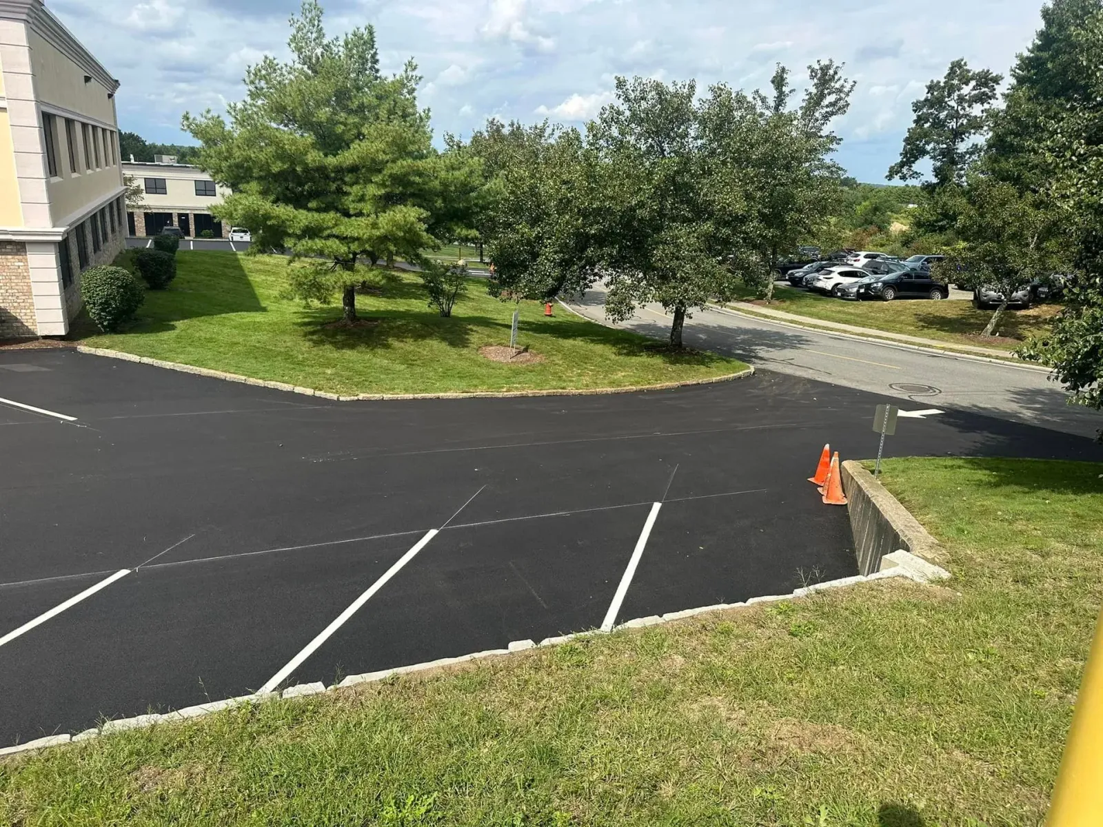 a parking lot with a building in the background