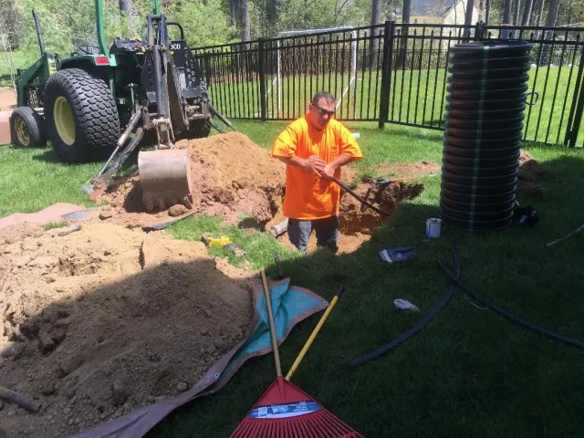 CleanSeptics crew performing septic system maintenance