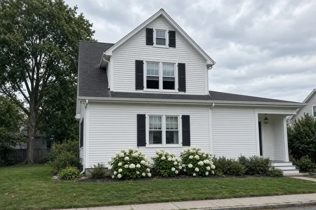 Replacement windows on a white Connecticut colonial