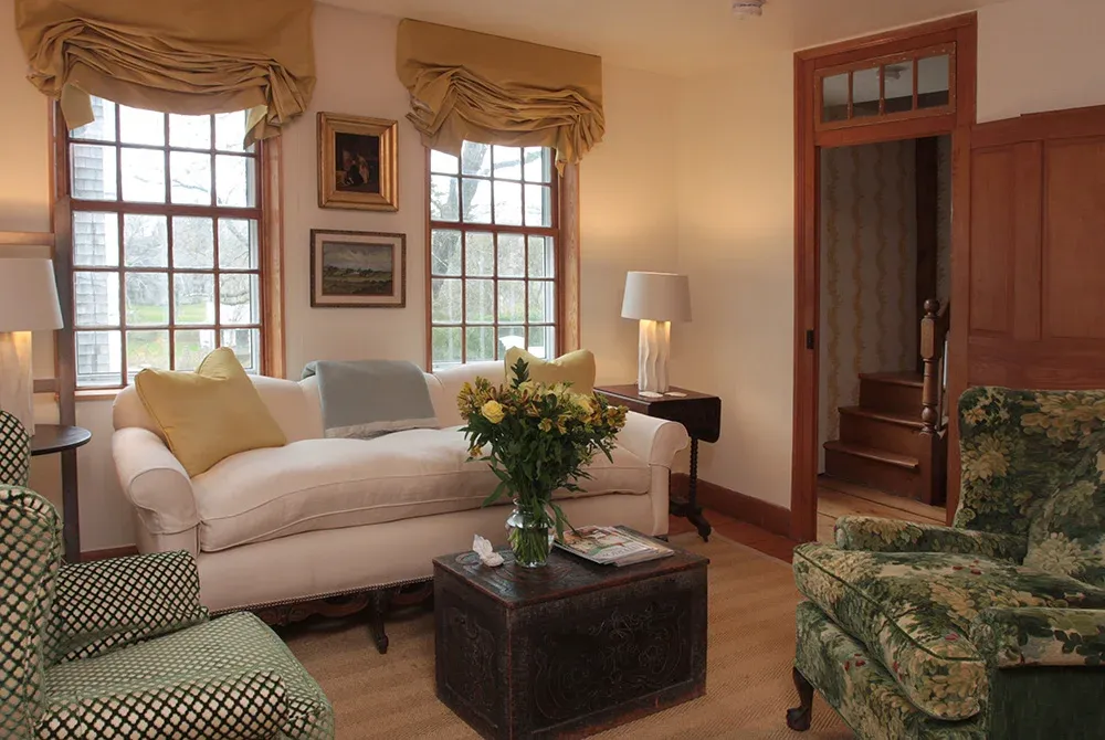 Restored living room with period trim and paneling