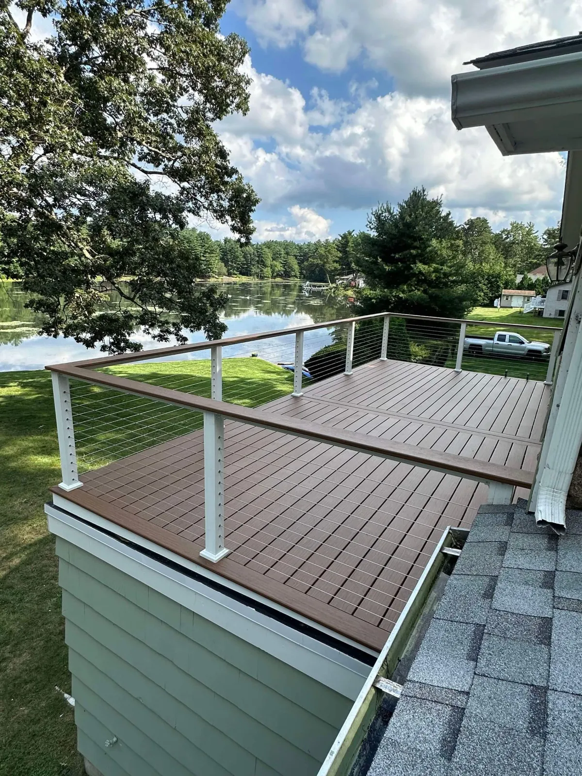 A man is working on the roof of a house.