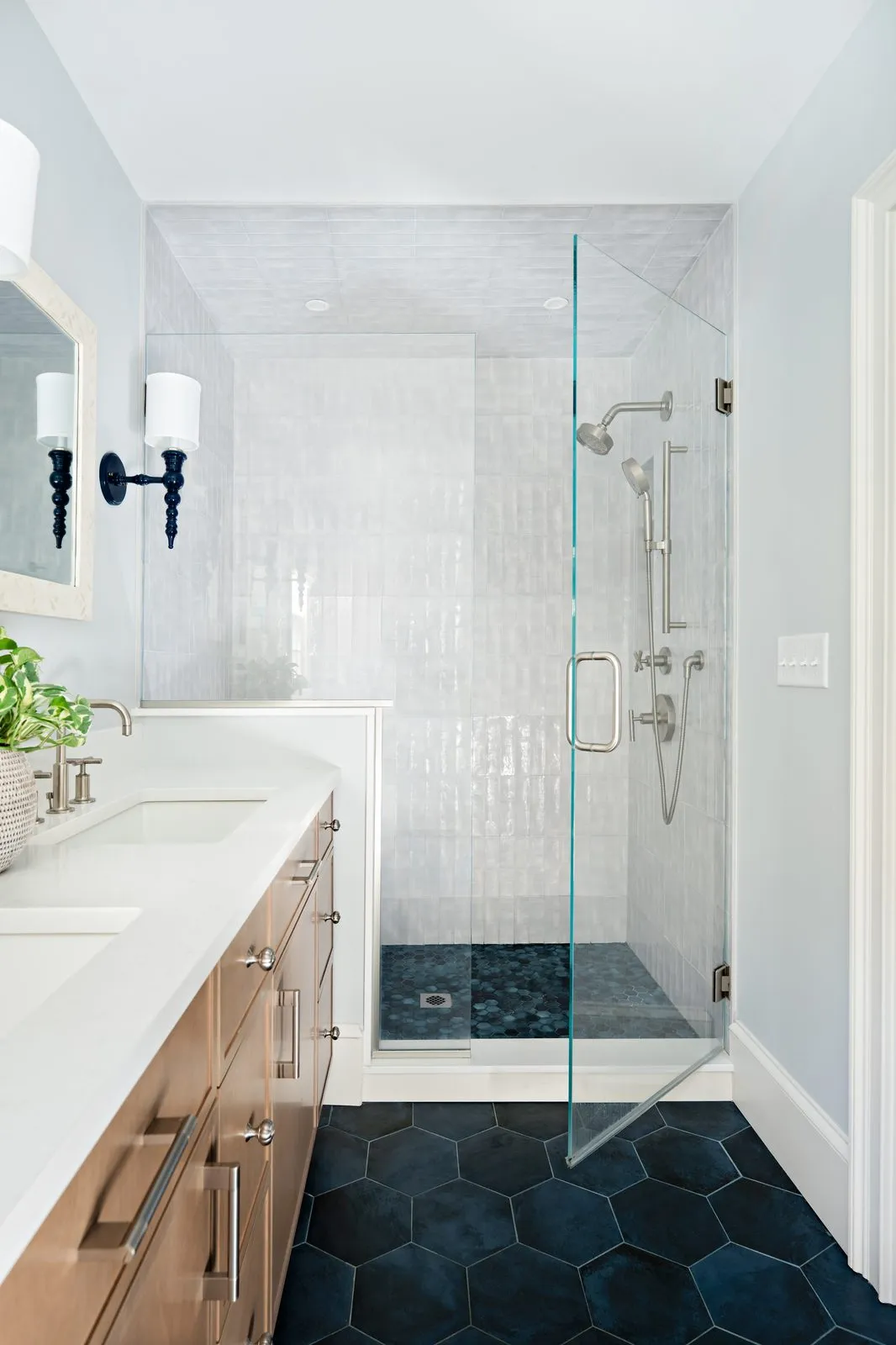 Jerusalem Road bathroom with dark hexagon floor tile, glass shower enclosure, and white oak vanity