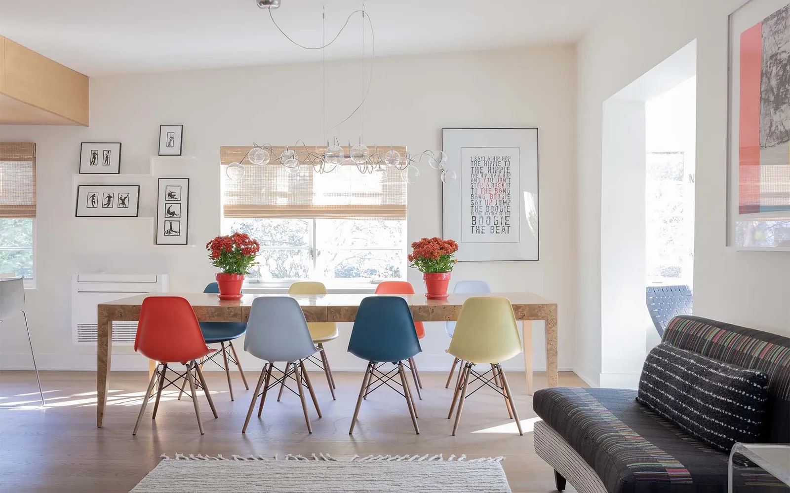 A dining room with a couch and a table