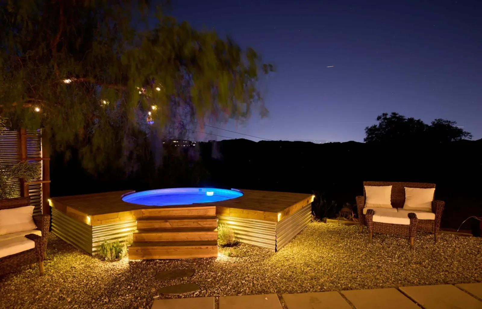 The cowboy pool lit at night
