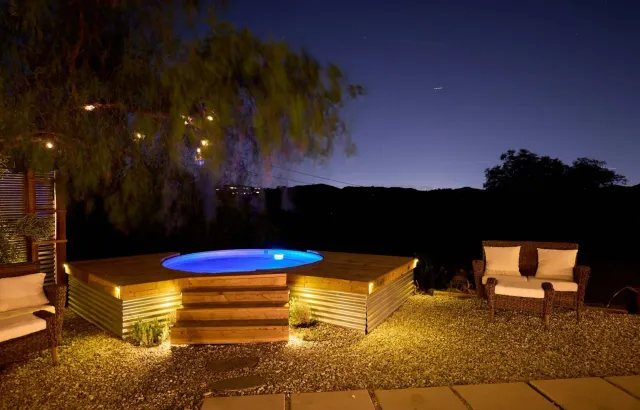 The cowboy pool lit at night