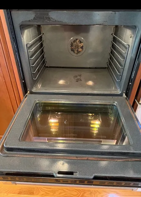 The same oven shining after a GA Cleaning Service deep clean