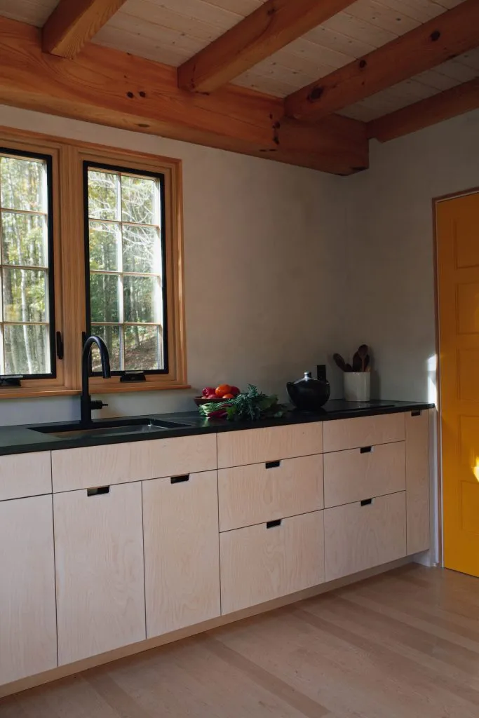 white plywood kitchen simple light wood natural wood plywood cabinets no hardware dark countertop