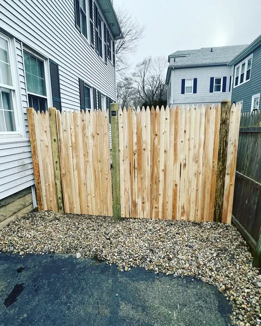New cedar stockade fence installed between two houses