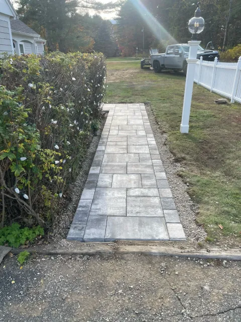 Gray limestone entry path built in Scarborough, Maine by The Englishmen Masonry